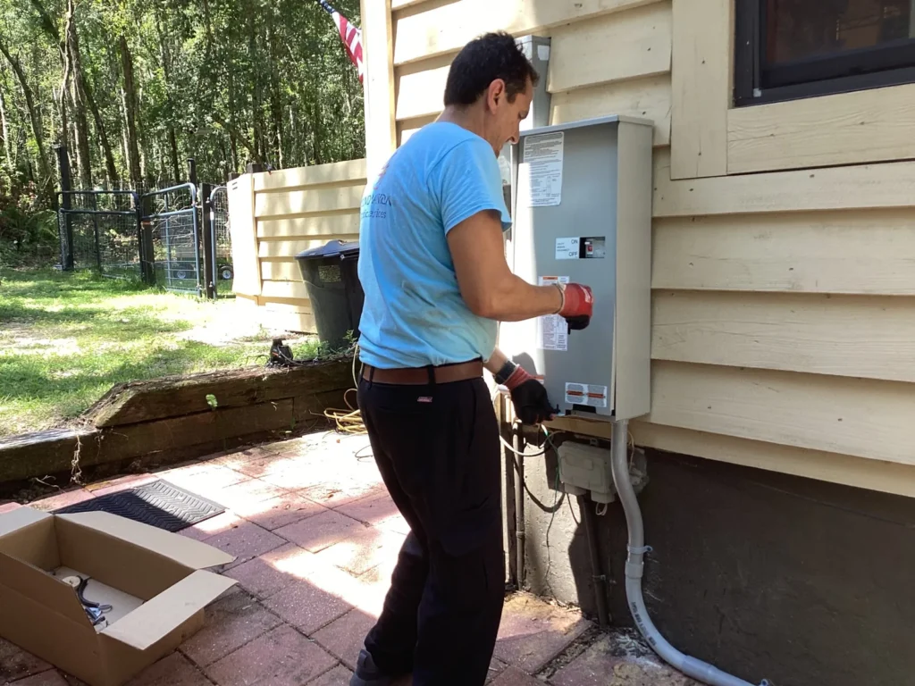 Electrician Near Me in Tampa Installing Electrical Panel Second Opinion Electric licensed electrician near me in Tampa installing electrical panel at residential home